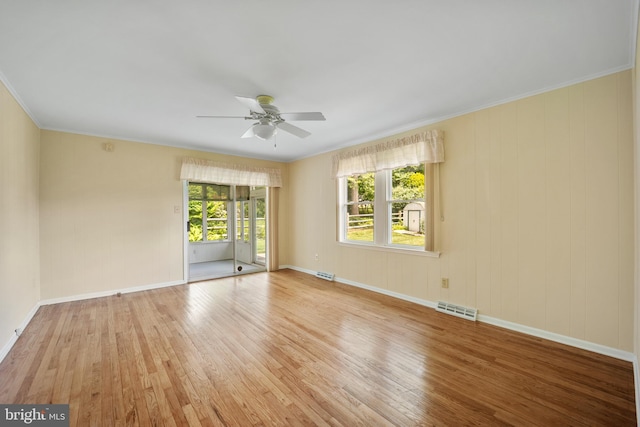 510 Revere Ct, Hockessin, DE 19707 - spare room featuring wood-type flooring, a ceiling fan, and crown molding
