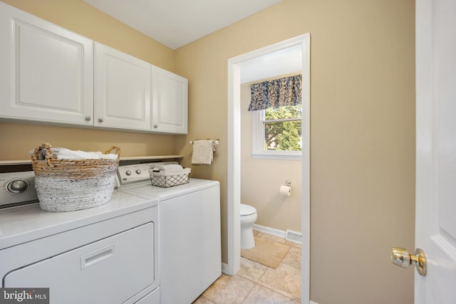 510 Revere Ct, Hockessin, DE 19707 - laundry room with separate washer and dryer, cabinet space, and light tile patterned floors