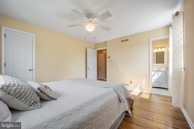 510 Revere Ct, Hockessin, DE 19707 - bedroom featuring wood finished floors, a ceiling fan, and ensuite bathroom