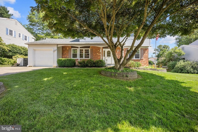 510 Revere Ct, Hockessin, DE 19707 - view of front of house with concrete driveway, an attached garage, brick siding, and a front yard