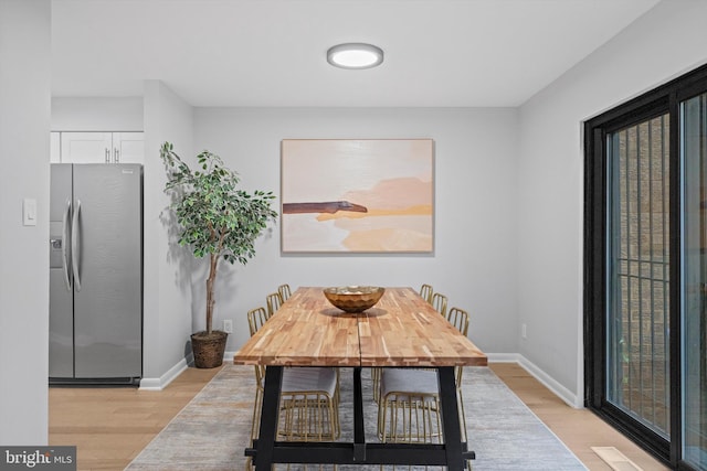 3114 Berry Rd NE Unit 21, Washington, DC 20018 - dining space with light wood-style floors and baseboards