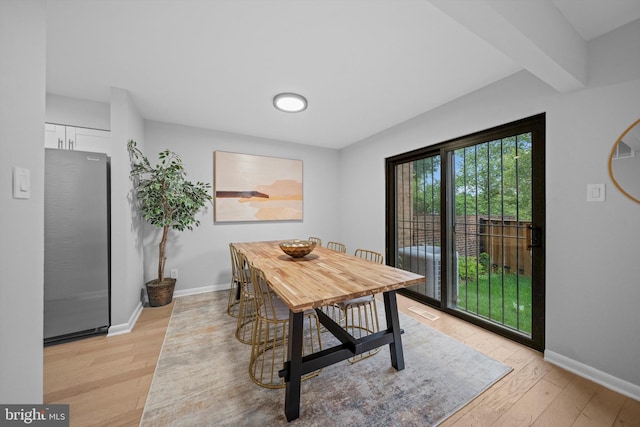 3114 Berry Rd NE Unit 21, Washington, DC 20018 - dining area with light wood-type flooring and beamed ceiling