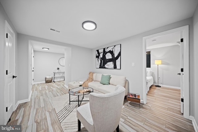 3114 Berry Rd NE Unit 21, Washington, DC 20018 - living room featuring light wood-type flooring and baseboards