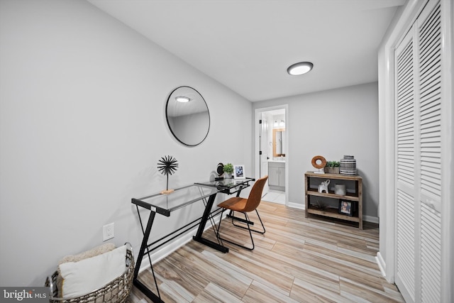 3114 Berry Rd NE Unit 21, Washington, DC 20018 - home office with light wood-style flooring and baseboards
