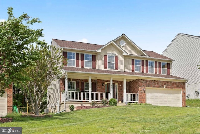 14813 Blackburn Rd, Burtonsville, MD 20866 - view of front of home featuring a garage, covered porch, a front yard, and brick siding