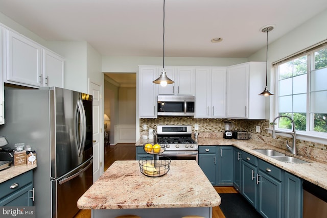 14813 Blackburn Rd, Burtonsville, MD 20866 - kitchen featuring stainless steel appliances, blue cabinets, dark wood-style floors, and white cabinetry