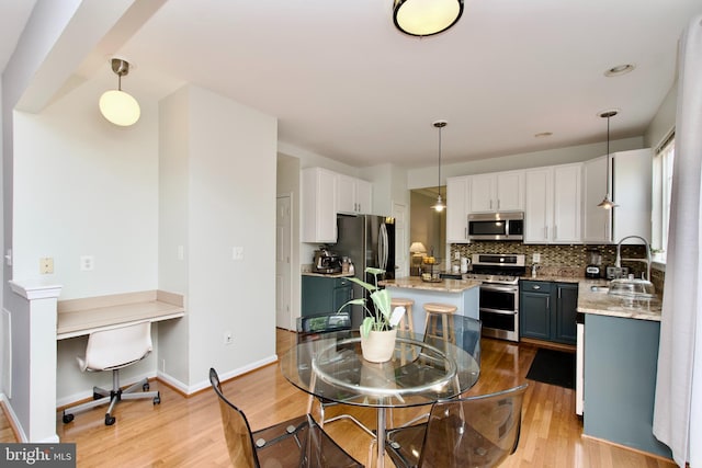 14813 Blackburn Rd, Burtonsville, MD 20866 - dining room featuring light wood-style floors and built in study area