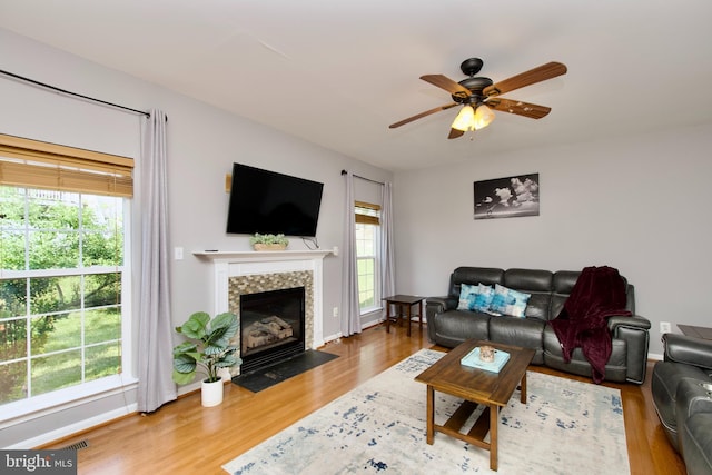 14813 Blackburn Rd, Burtonsville, MD 20866 - living room featuring wood finished floors, ceiling fan, and a fireplace