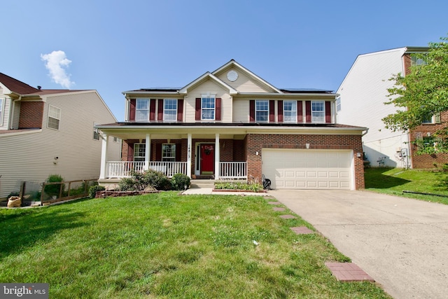 14813 Blackburn Rd, Burtonsville, MD 20866 - view of front of house featuring a porch, brick siding, concrete driveway, and a front yard
