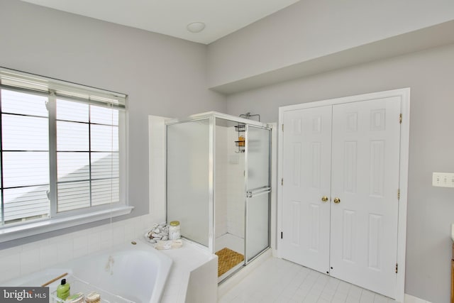14813 Blackburn Rd, Burtonsville, MD 20866 - bathroom featuring a shower stall, a bath, and tile patterned flooring