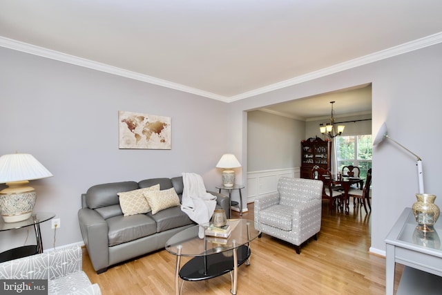 14813 Blackburn Rd, Burtonsville, MD 20866 - living area featuring crown molding, a chandelier, wood finished floors, and wainscoting