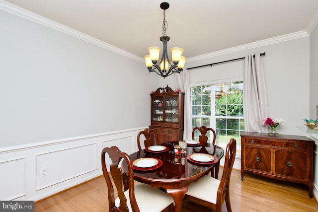 14813 Blackburn Rd, Burtonsville, MD 20866 - dining room featuring a chandelier, crown molding, light wood-style floors, and wainscoting