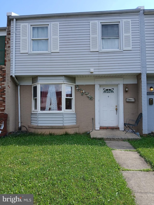 8230 Community Dr, Manassas, VA 20109 - view of property featuring a front yard and brick siding