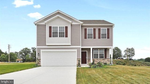 2 American Ave, Carlisle, PA 17013 - view of front facade featuring a front lawn, a garage, concrete driveway, and stone siding
