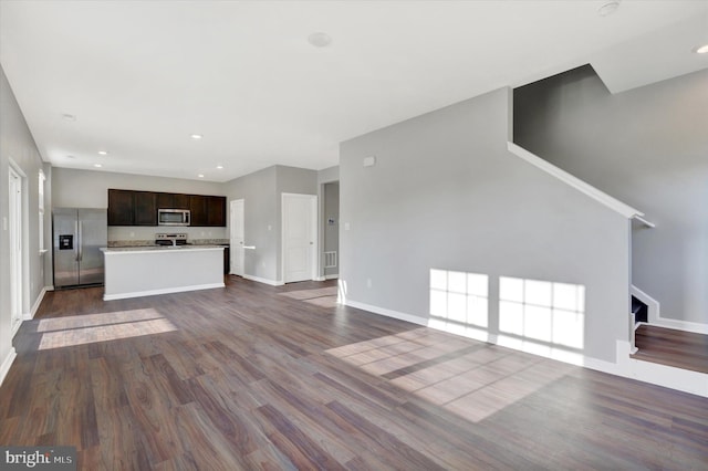 2 American Ave, Carlisle, PA 17013 - unfurnished living room featuring dark wood-type flooring, stairs, and recessed lighting