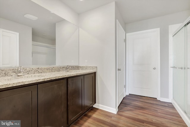 2 American Ave, Carlisle, PA 17013 - full bath featuring wood finished floors, double vanity, and a shower stall