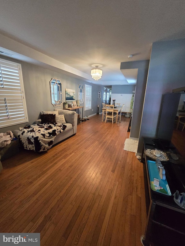 214 Dennison St, Colonial Beach, VA 22443 - living area with a chandelier and hardwood / wood-style flooring