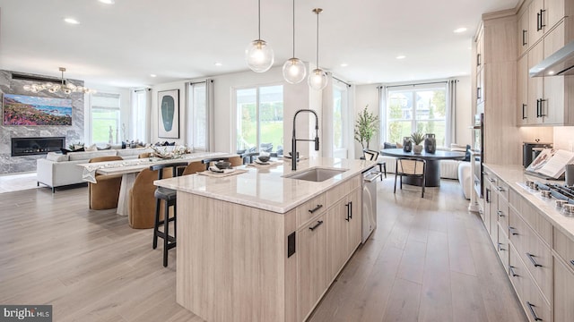 LOT29-109 Tiffany Ln, Spring City, PA 19475 - kitchen with dishwasher, a kitchen breakfast bar, light wood-style floors, range hood, and recessed lighting