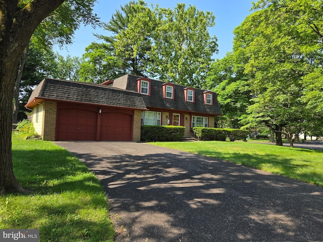 100 E Eagle Ln, Cherry Hill, NJ 08003 - front of property featuring mansard roof, an attached garage, brick siding, a front yard, and roof with shingles