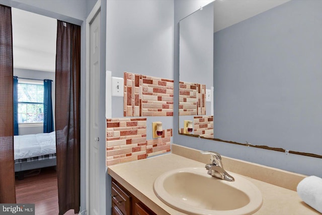 26 Millbank Ln, Voorhees, NJ 08043 - bathroom with vanity, ensuite bath, and wood finished floors