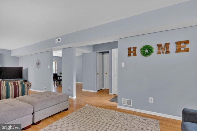 26 Millbank Ln, Voorhees, NJ 08043 - living room featuring light wood finished floors and baseboards