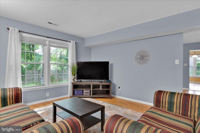 26 Millbank Ln, Voorhees, NJ 08043 - living room with baseboards and wood finished floors