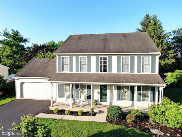 321 Coventry Ln, Lititz, PA 17543 - colonial home featuring covered porch, asphalt driveway, and an attached garage
