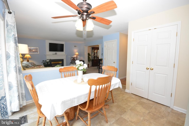 321 Coventry Ln, Lititz, PA 17543 - dining space with a ceiling fan and a glass covered fireplace