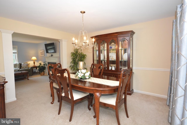 321 Coventry Ln, Lititz, PA 17543 - dining area with a chandelier, light colored carpet, and a fireplace