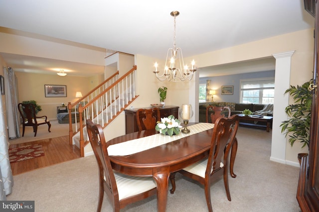 321 Coventry Ln, Lititz, PA 17543 - dining area featuring light carpet, stairway, and a chandelier