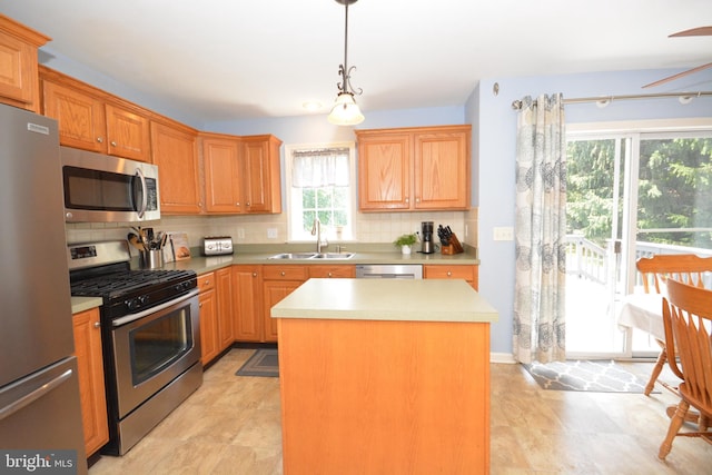 321 Coventry Ln, Lititz, PA 17543 - kitchen with stainless steel appliances, decorative backsplash, light countertops, and a kitchen island