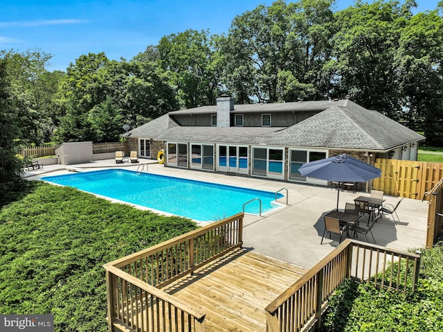 220 Longview Blvd, Gettysburg, PA 17325 - view of swimming pool with a patio area, a deck, and view of wooded area