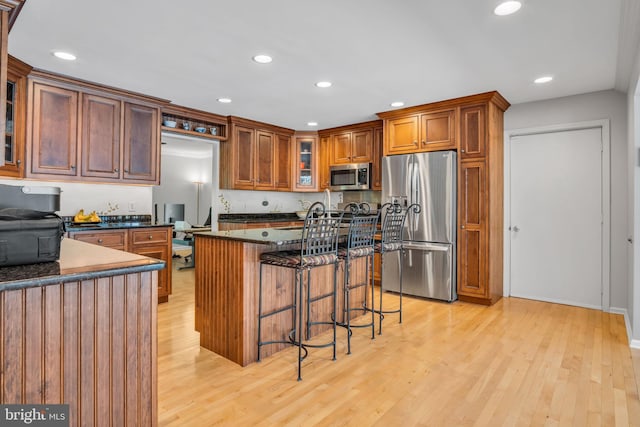 220 Longview Blvd, Gettysburg, PA 17325 - kitchen featuring appliances with stainless steel finishes, light wood-type flooring, a breakfast bar, a kitchen island, and recessed lighting