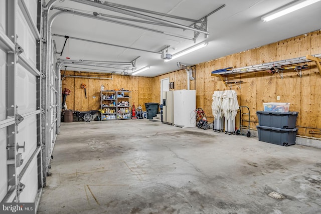 220 Longview Blvd, Gettysburg, PA 17325 - garage featuring a garage door opener and wood walls