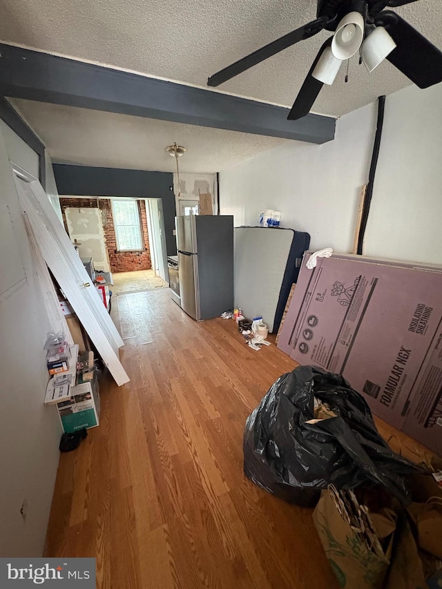 3420 D St, Philadelphia, PA 19134 - living area with a textured ceiling, wood finished floors, beam ceiling, and a ceiling fan