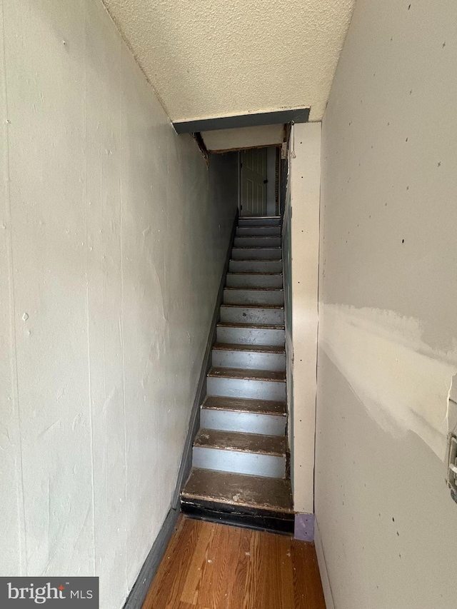 3420 D St, Philadelphia, PA 19134 - stairway featuring wood finished floors and a textured ceiling