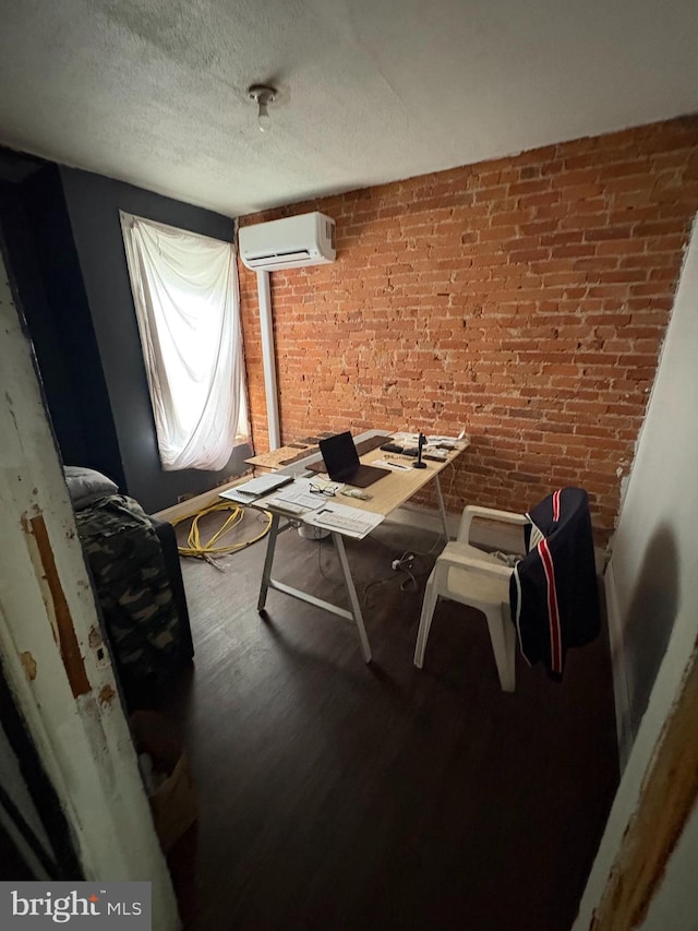 3420 D St, Philadelphia, PA 19134 - dining room featuring a wall unit AC, a textured ceiling, wood finished floors, brick wall, and an office area