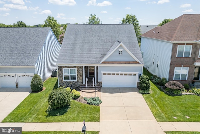 6037 Calumet Ct, Gainesville, VA 20155 - view of front facade featuring a front yard, a standing seam roof, stone siding, and a garage
