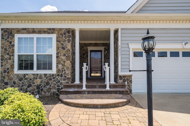 6037 Calumet Ct, Gainesville, VA 20155 - property entrance featuring stone siding and an attached garage