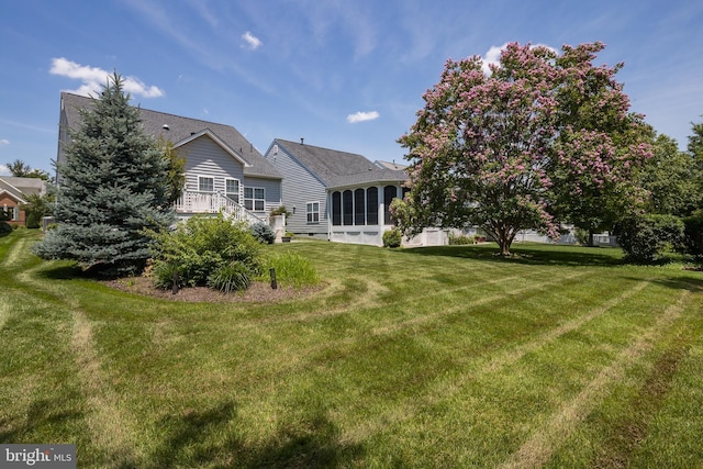 6037 Calumet Ct, Gainesville, VA 20155 - rear view of property featuring a yard, a sunroom, and a shingled roof