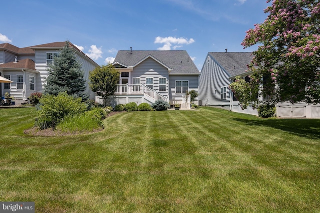 6037 Calumet Ct, Gainesville, VA 20155 - rear view of property with a yard and a wooden deck