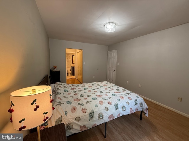9711 Kings Crown Ct Unit 101, Fairfax, VA 22031 - bedroom featuring wood finished floors and ensuite bathroom