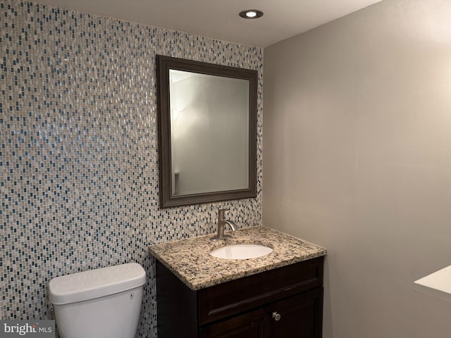 9711 Kings Crown Ct Unit 101, Fairfax, VA 22031 - half bath featuring vanity, recessed lighting, and tile walls