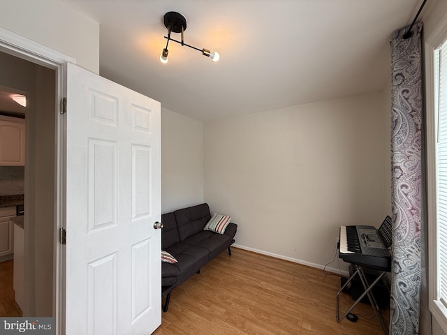 9711 Kings Crown Ct Unit 101, Fairfax, VA 22031 - sitting room featuring light wood-style floors and baseboards