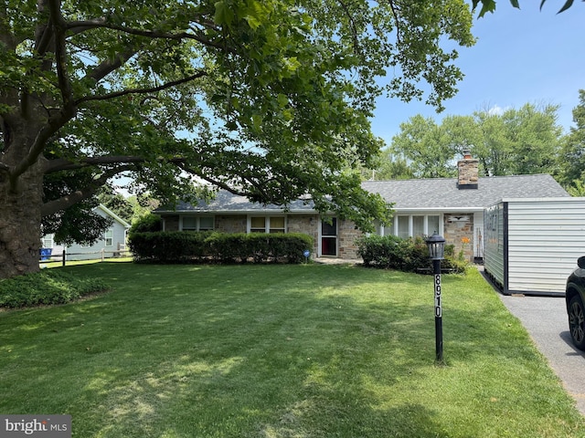 8910 Wilton Ave, Ellicott City, MD 21043 - ranch-style home with a front yard, a chimney, and a shingled roof