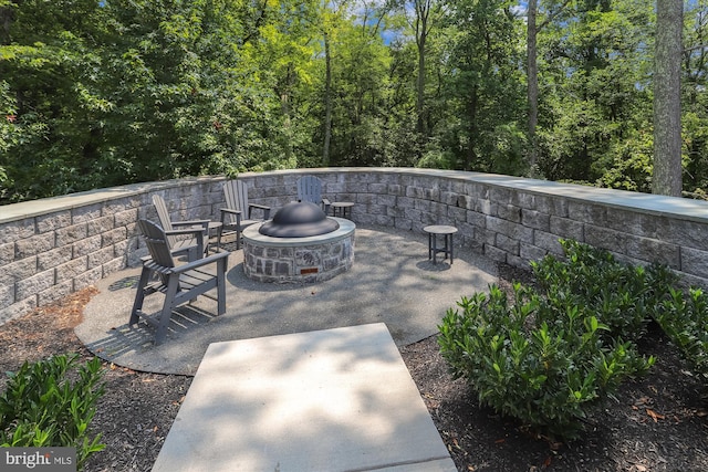 6107 Fairview Farm Dr Unit 306, Alexandria, VA 22315 - view of patio featuring an outdoor fire pit