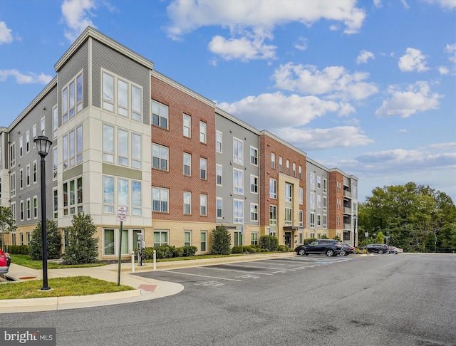 6107 Fairview Farm Dr Unit 306, Alexandria, VA 22315 - view of building exterior with uncovered parking
