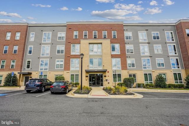 6107 Fairview Farm Dr Unit 306, Alexandria, VA 22315 - view of building exterior featuring uncovered parking