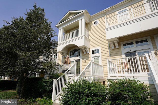 38337 N Mill Ln Unit 116, Ocean View, DE 19970 - view of front facade with a balcony and stairs