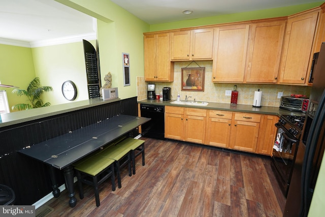 38337 N Mill Ln Unit 116, Ocean View, DE 19970 - kitchen with black appliances, backsplash, dark wood-type flooring, crown molding, and dark countertops